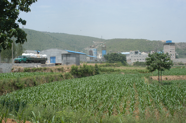 Factory nestled in the mountain landscape
