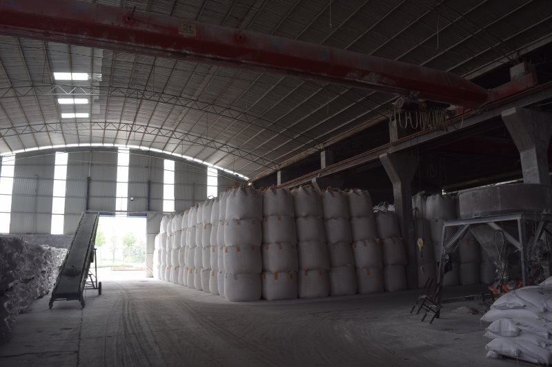 Truck loading area β containers being filled